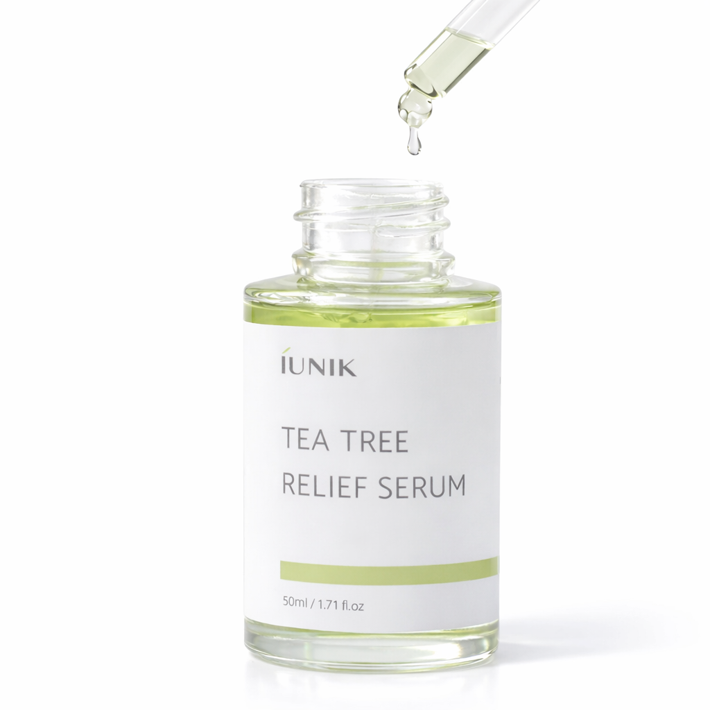 IUNIK Tea tree relief serum bottle with dropper on a white background