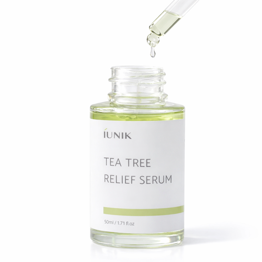 IUNIK Tea tree relief serum bottle with dropper on a white background